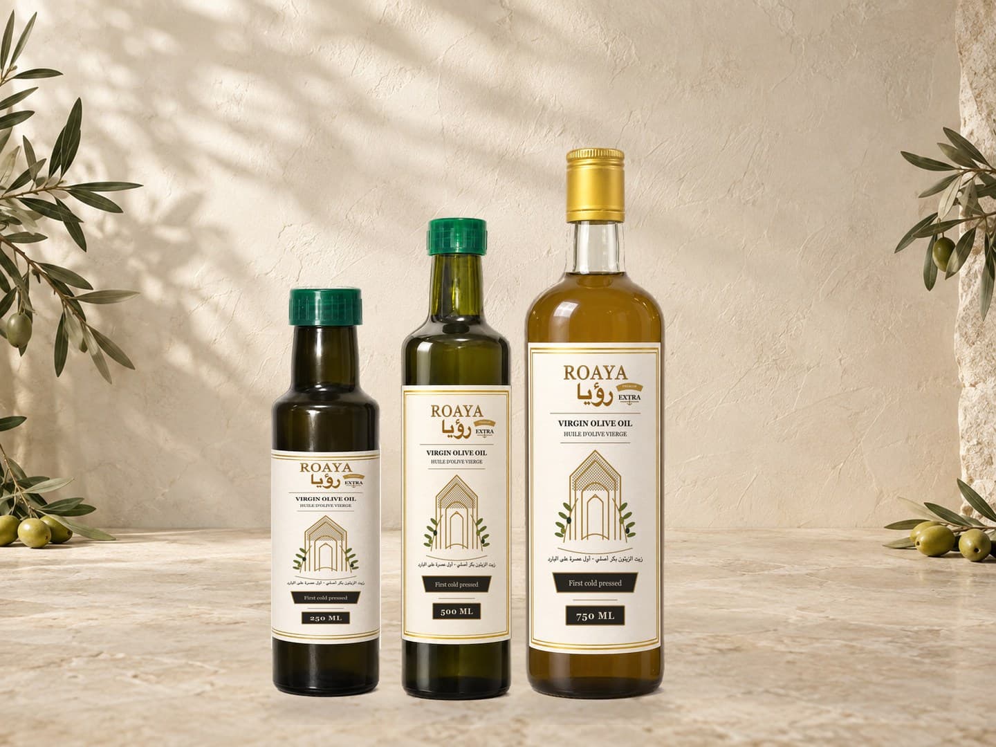ROAYA virgin olive oil bottle collection on a warm kitchen counter